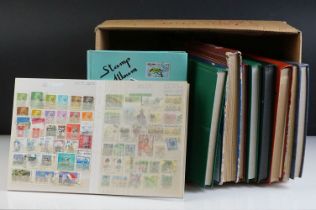 Collection of world stamps across seven albums, mostly including Australian stamps of the late