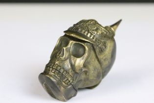 A brass skull Vesta case