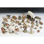 Beswick animal figurines to include a pig, kingfisher, two robins, chaffinch, goldfinch, owl, Miss