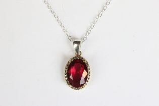 A silver CZ and tourmaline style pendant necklace