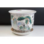 Chinese jardinere plant pot having a white ground with tube lined peonies to the sides and character