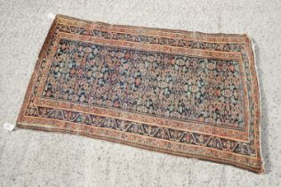 Eastern Wool Blue and Red Ground Rug with geometric design within a border, approx. 193cm x 116cm