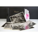 A early to mid 20th century photograph album containing photographs from a film set to include