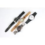 A collection of three gents Swatch wristwatches to include an Irony example together with a Tommy