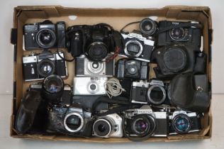 Collection of SLR and 35mm film cameras, mainly with lenses, to include Canon, Olympus, Zenit,