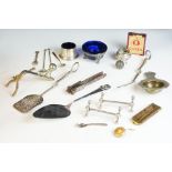 A small group of mixed collectables to include silver plated knife rests, salts and spoons,