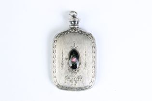 A vintage sterling silver scent bottle with floral decoration and central floral ceramic cabochon.