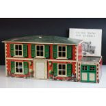 1950s Mettoy tin plate dolls house and garage with assembly instructions, approx 60cm wide