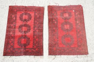 Pair of Eastern Red Ground Prayer Mats or Small Rugs, each decorated with three guls within a