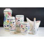 Collection of Poole Pottery ceramics to include four vases each having a white ground with painted