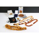A small collection of mainly Amber jewellery to include beaded necklaces, silver pendant