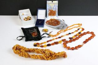 A small collection of mainly Amber jewellery to include beaded necklaces, silver pendant