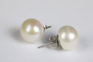 A pair of large freshwater pearl studs on silver posts