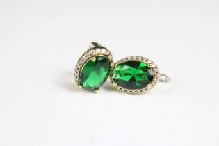 A pair of silver CZ and faux emerald earrings