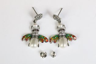 A pair of silver and plique a jour bug earrings