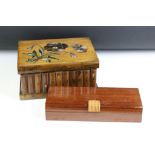 Sorrento Ware olive wood puzzle box modelled as a row of books, with painted floral decoration to