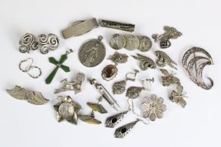 A collection of mixed sterling silver jewellery to include tie clip, necklaces, pendants,