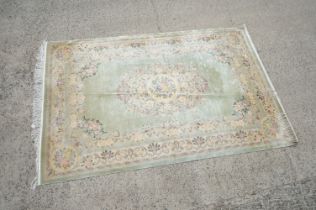 Green ground Chinese Silk Rug with floral pattern, approx. 278cm x 183cm