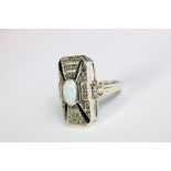 A substantial silver marcasite art deco style ring with opal panel