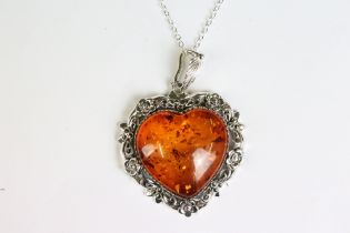 A substantial silver and amber heart shaped pendant necklace