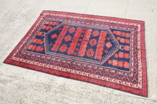 Red and Blue Ground Yagcibedir style Rug with geometric design within a border, approx. 297cm x