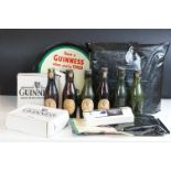 Advertising - A quantity of Guinness collectables to include a drinks tray, 6 x vintage empty