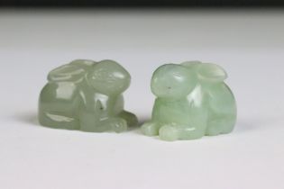 Two hand carved jade ornaments in the form of rabbits.