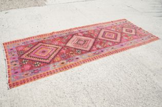 Wool Red Ground Kilim style Rug with geometric design, approx. 380cm x 140cm