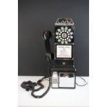 Wild & Wolf American style contemporary coin operated wall telephone, with ring dial and receiver.