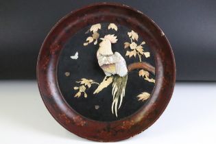 Japanese lacquered wall plaque of dished circular form, with applied bone and mother-of-pearl