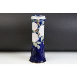 Early 20th Century Royal Doulton vase having a blue ground with tube lined rose detailing. Impressed