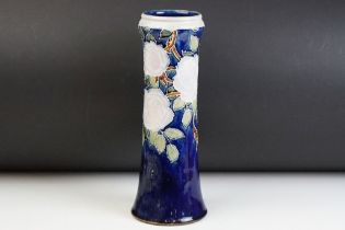 Early 20th Century Royal Doulton vase having a blue ground with tube lined rose detailing. Impressed