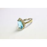 A silver ring set with CZ and faux blue topaz ring