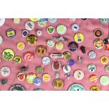 A collection of vintage button / pin badges to include advertising and enamel examples.
