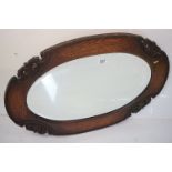 Early 20th century oak oval mirror, 82cm long