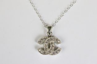 A silver and CZ designer style pendant necklace