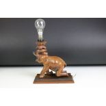 Indian carved hardwood table lamp in the form of an elephant (measures approx 32.5cm high -