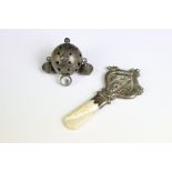 Two antique sterling silver babies rattles, one with mother of pearl handle.