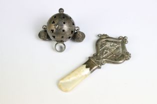 Two antique sterling silver babies rattles, one with mother of pearl handle.
