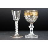 19th Century cordial glass with a double series air twist stem together with a faceted glass