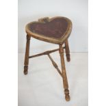 Arts and Crafts Beech Stool, the seat in the form of a heart or spade, raised on three turned