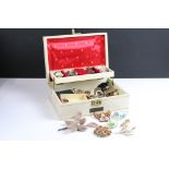 A collection of mixed brooches contained within a jewellery box to include Lea Stein style