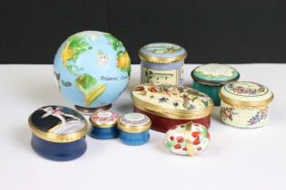 A collection of nine enamel trinket boxes to include Halcyon Days examples.