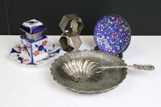 A small group of mixed collectables to include hallmarked silver napkin rings, a white metal