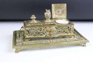 Victorian brass desk inkstand, of pierced rectangular form, with three lidded compartments, two
