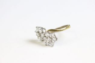 A gold plated on silver ring set with CZ flower heads