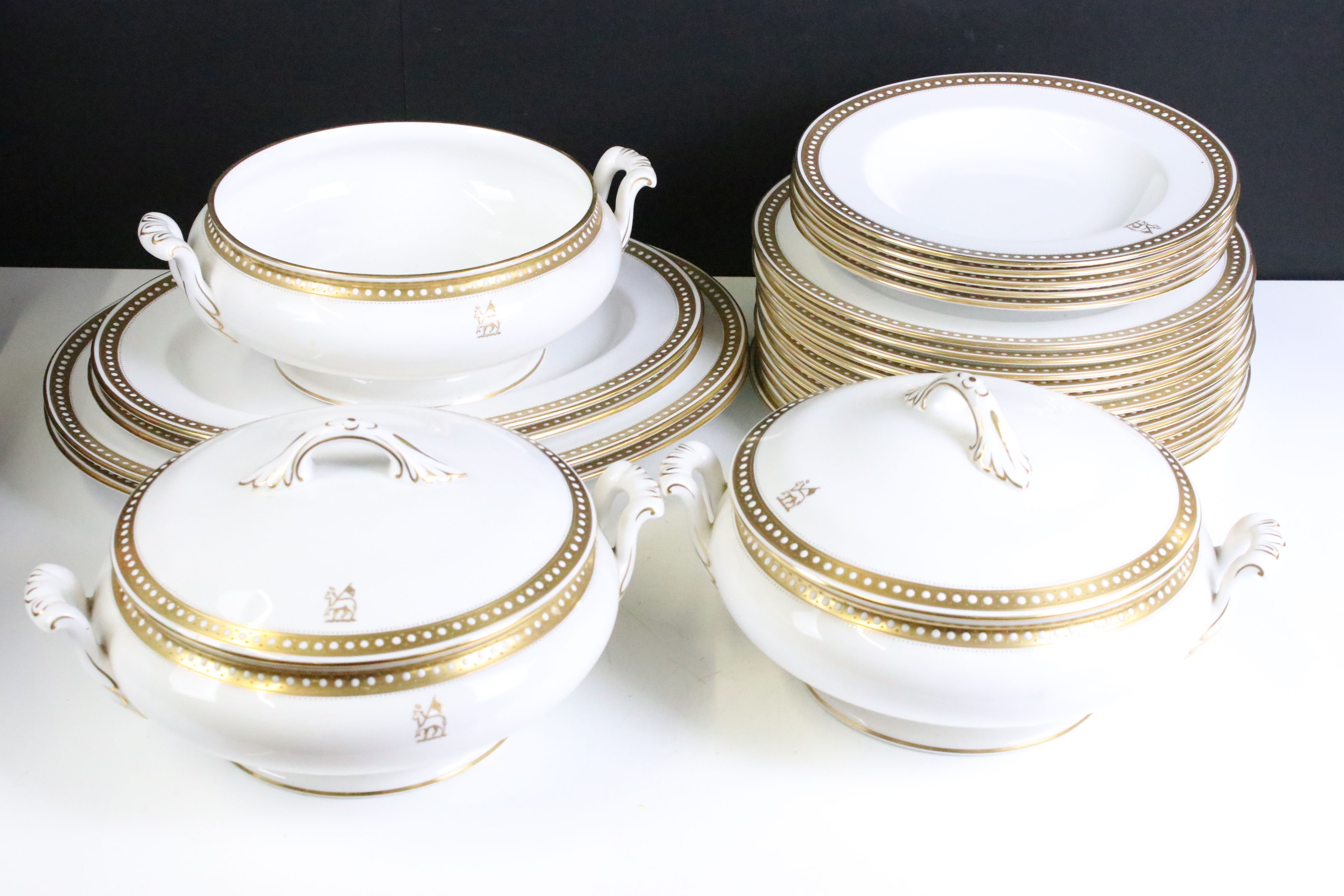 Early 20th Spode dinner service retailed by Thomas Goode & Co Ltd having a white ground with gilt