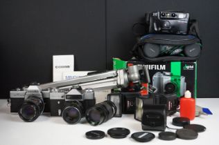 A small collection of mixed photographic equipment to include 35mm SLR cameras, lenses, tripod,