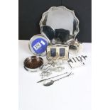 A collection of mixed metal ware to include a hallmarked silver photograph frame, silver coaster,