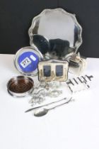 A collection of mixed metal ware to include a hallmarked silver photograph frame, silver coaster,